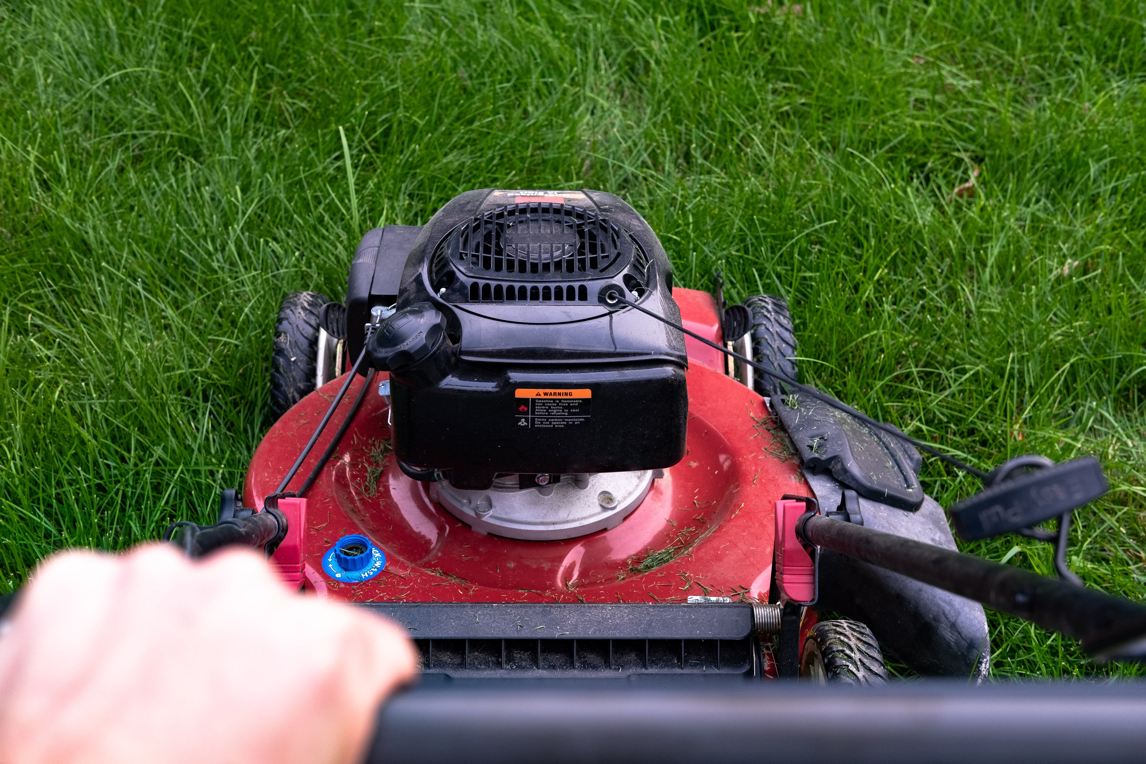 person-pushing-lawn-mower.jpg